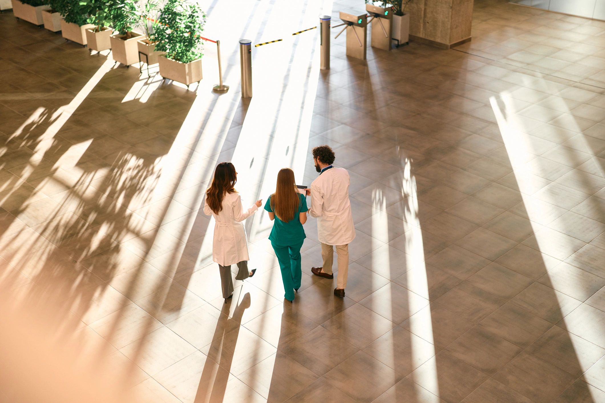 Healthcare professionals walking through a modern medical facility